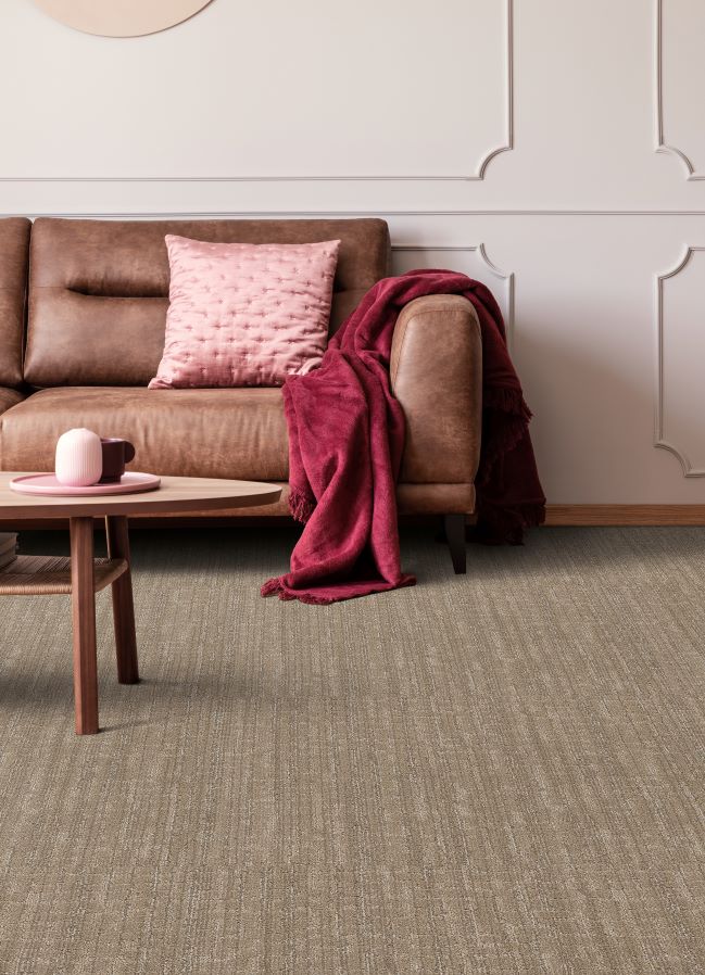 stylish brown textured carpet in a living room with a brown leather couch