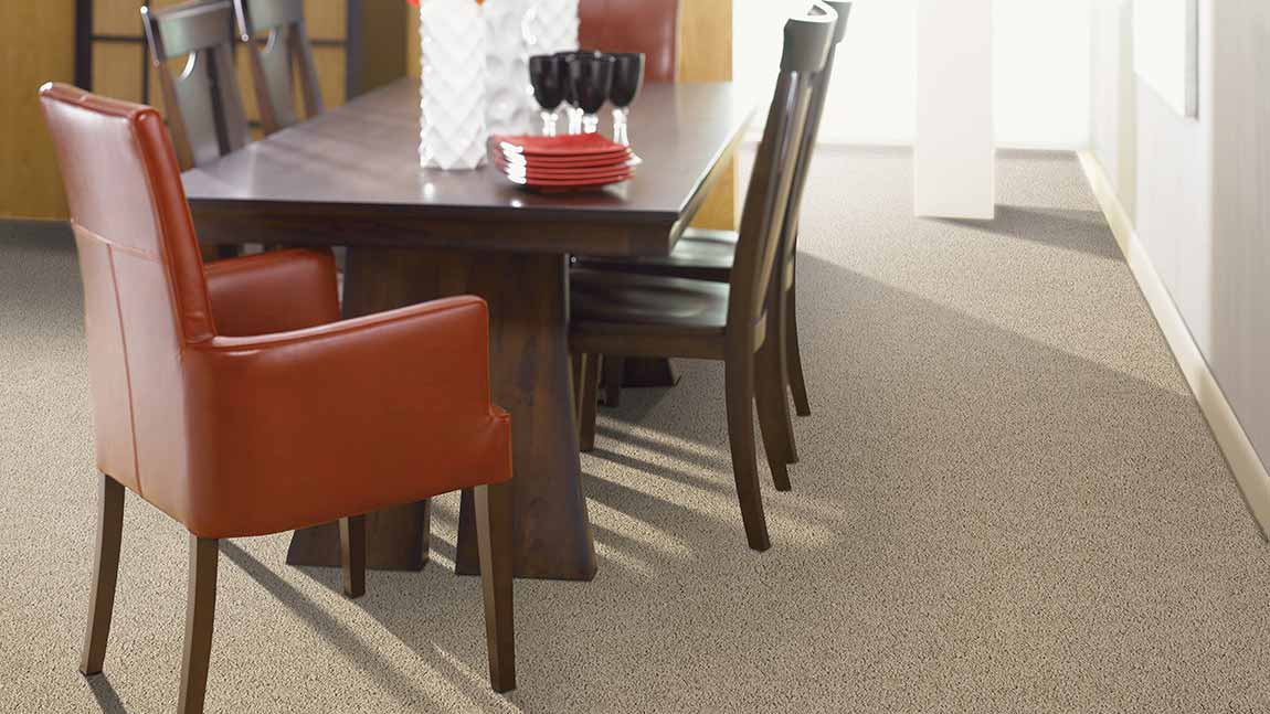 Carpet flooring in a dining room, installation services available.