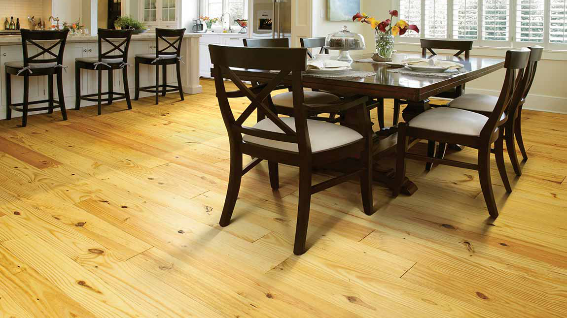 Hardwood flooring in a dining room, installation services available.